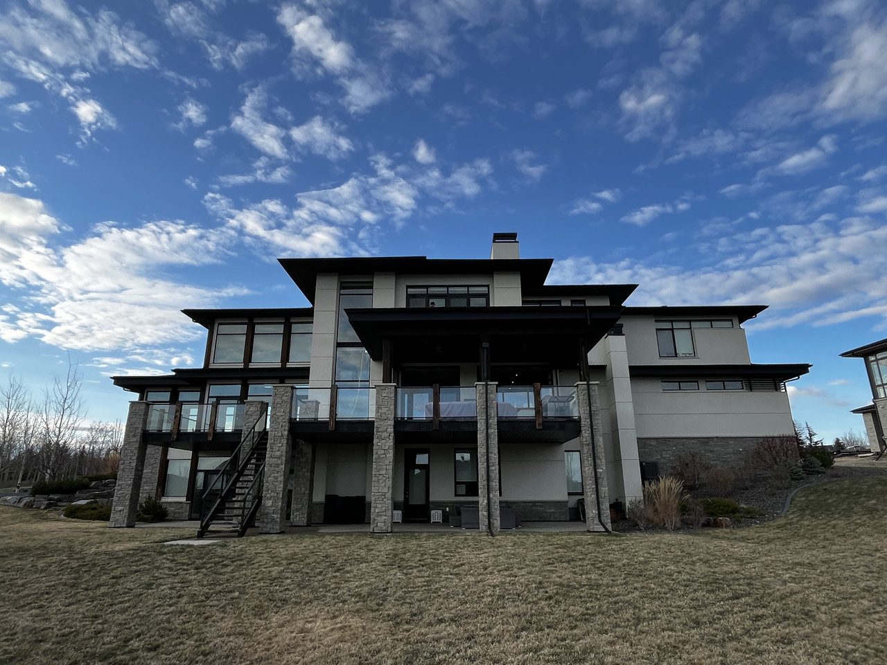 Custom home exterior windows cleaned by Clarity Co. in Calgary