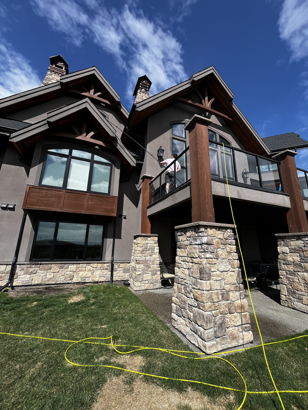 Custom Calgary home with clean exterior windows cared for by Clarity Co.